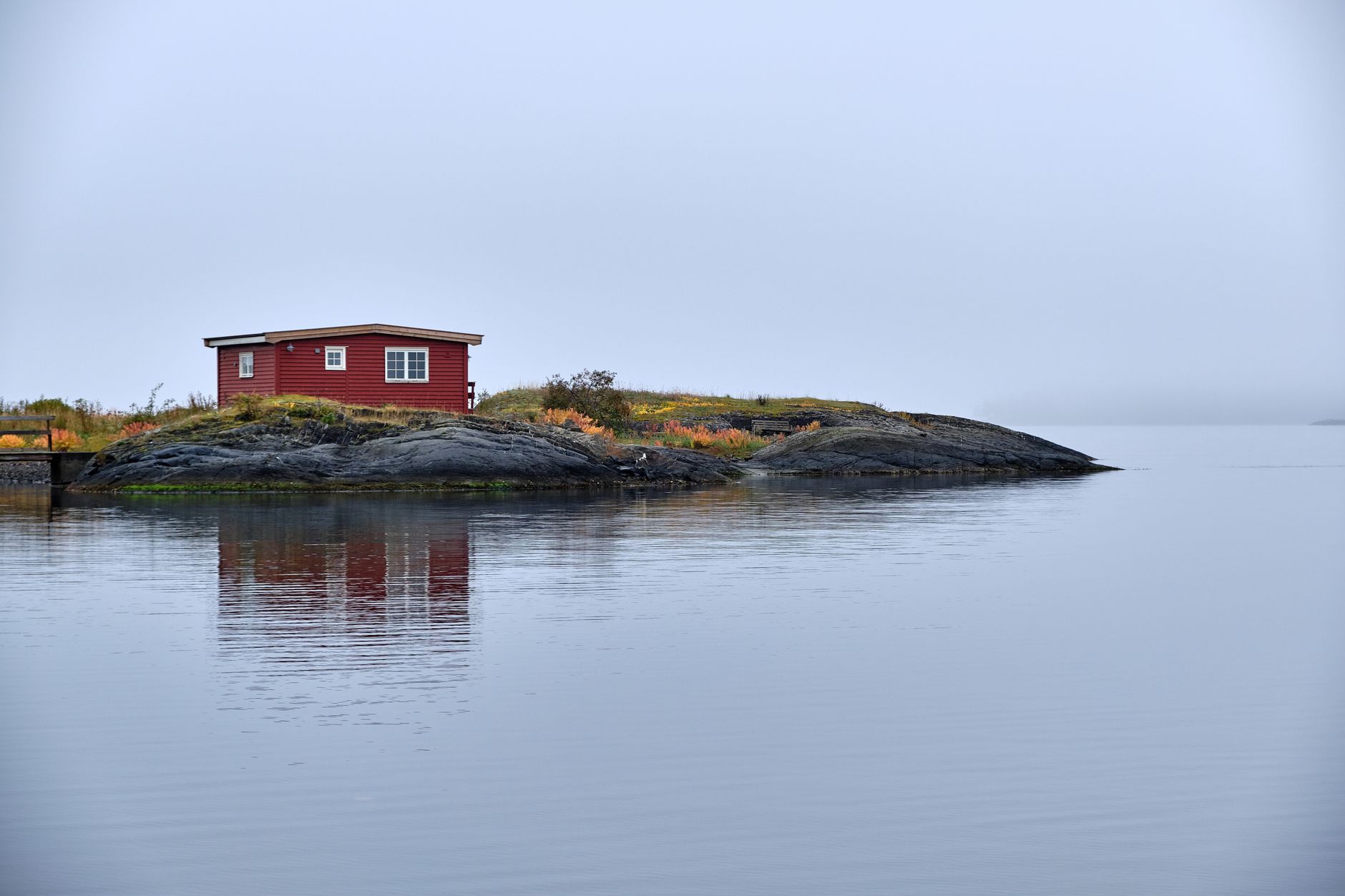 Remote Scandinavian lake and modern timber cottage
